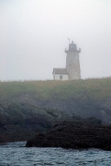 Libby Island Light on Foggy Shore in in Down East Maine